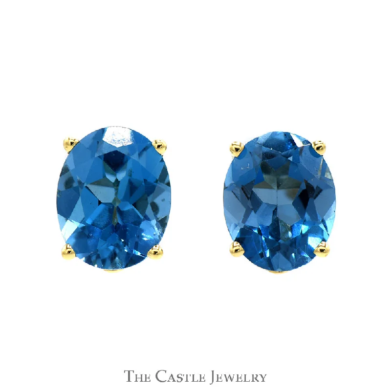 Oval Blue Topaz Studs in 14k Yellow Gold Basket Mounting